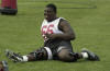 Nebraska lineman Le Kevin Smith stretches before team practice in Lincoln, Neb., Wednesday, Aug. 7, 2002. After missing all of last fall with a torn ligament in his right knee and spring practice with a nearly identical injury to his left knee, Smith is ready to play again. (AP Photo/Nati Harnik)