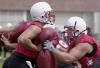Nebraska linemen Josh Sewell, right, and freshman Kristopher Lewin practice Monday, Aug. 5, 2002, in Lincoln, Neb. Seniors John Garrison and right tackle Dan Vili Waldrop will lead a young group of offensive linemen into the new season. (AP Photo/Nati Harnik)