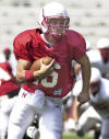 Nebraska backup quarterback Mike Stuntz runs for a touchdown during a scrimmage in Lincoln, Neb., Saturday, Aug. 10, 2002. The Nebraska football coaching staff got its first look at the progress that's been made in fall camp with this first closed scrimmage. (AP Photo/Nati Harnik)